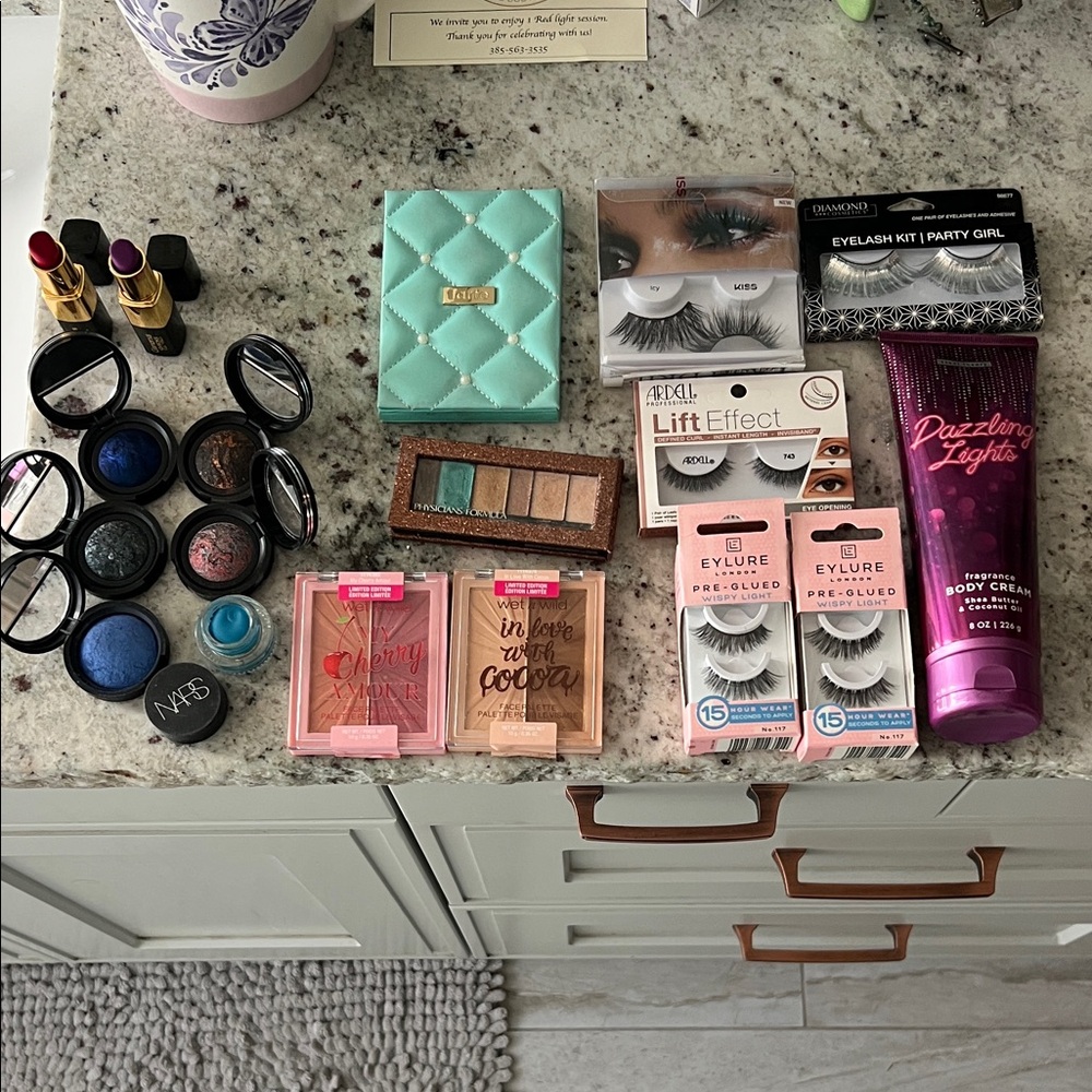 Makeup.  Eyelashes.  Lotion.  Lipstick.